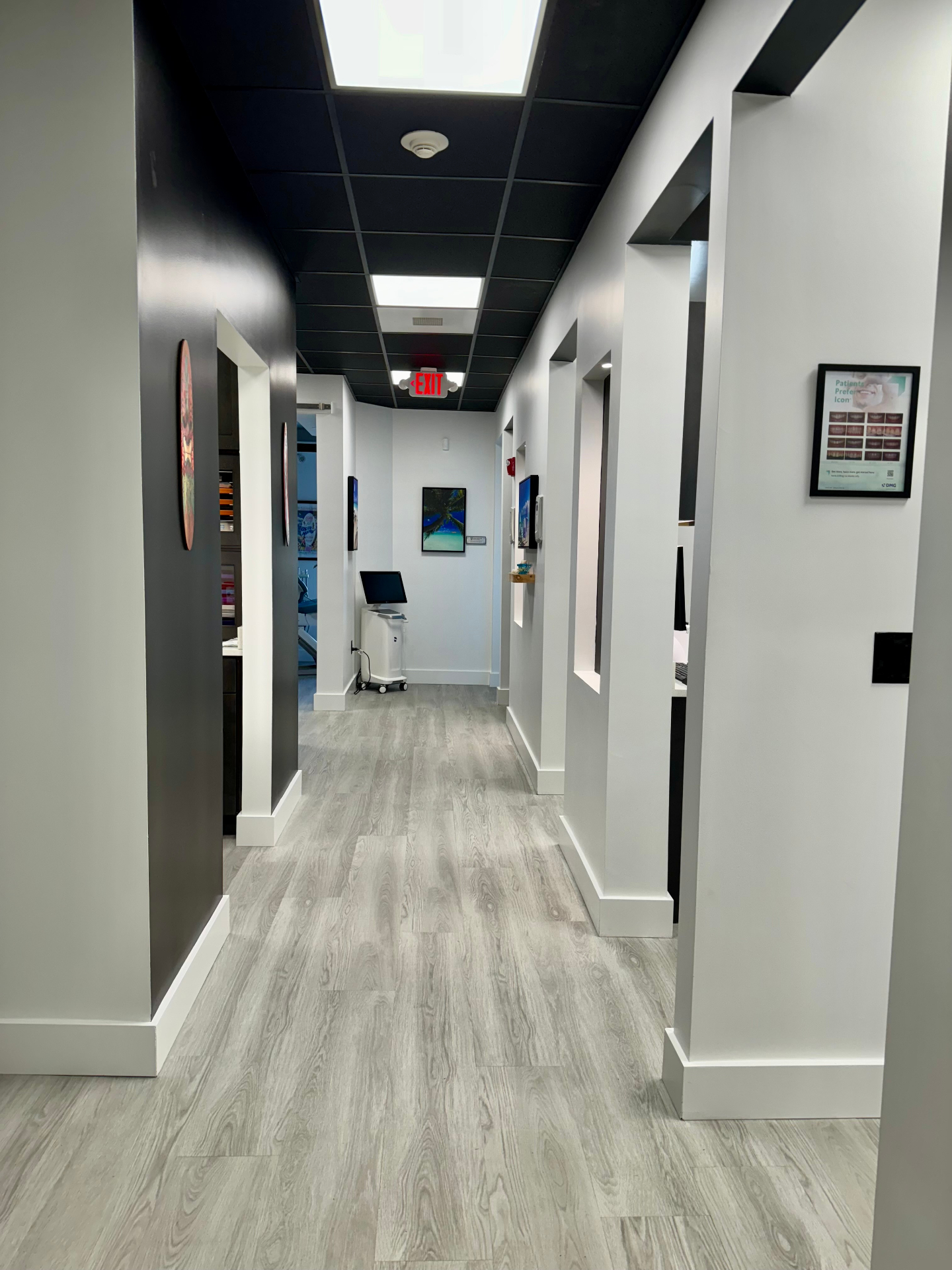Bright hallway with treatment rooms and digital scanner
