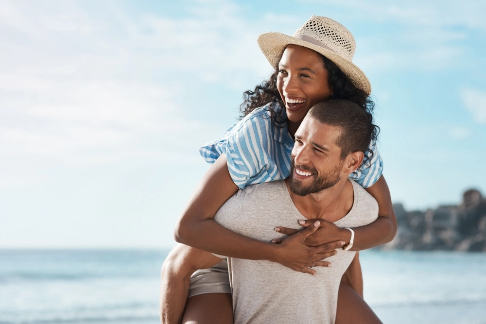 Smiling couple at the beach